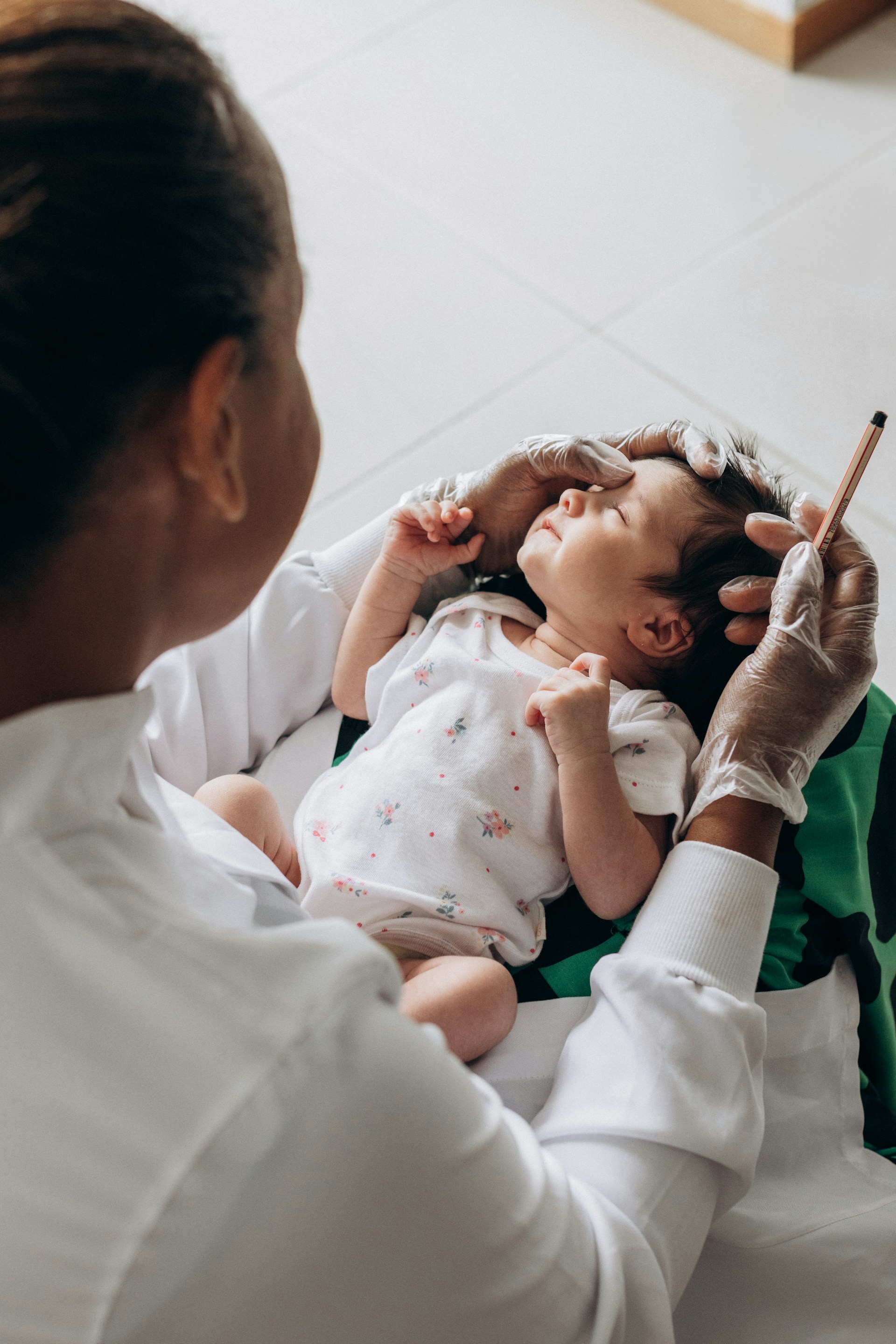 a woman holding a baby in her lap