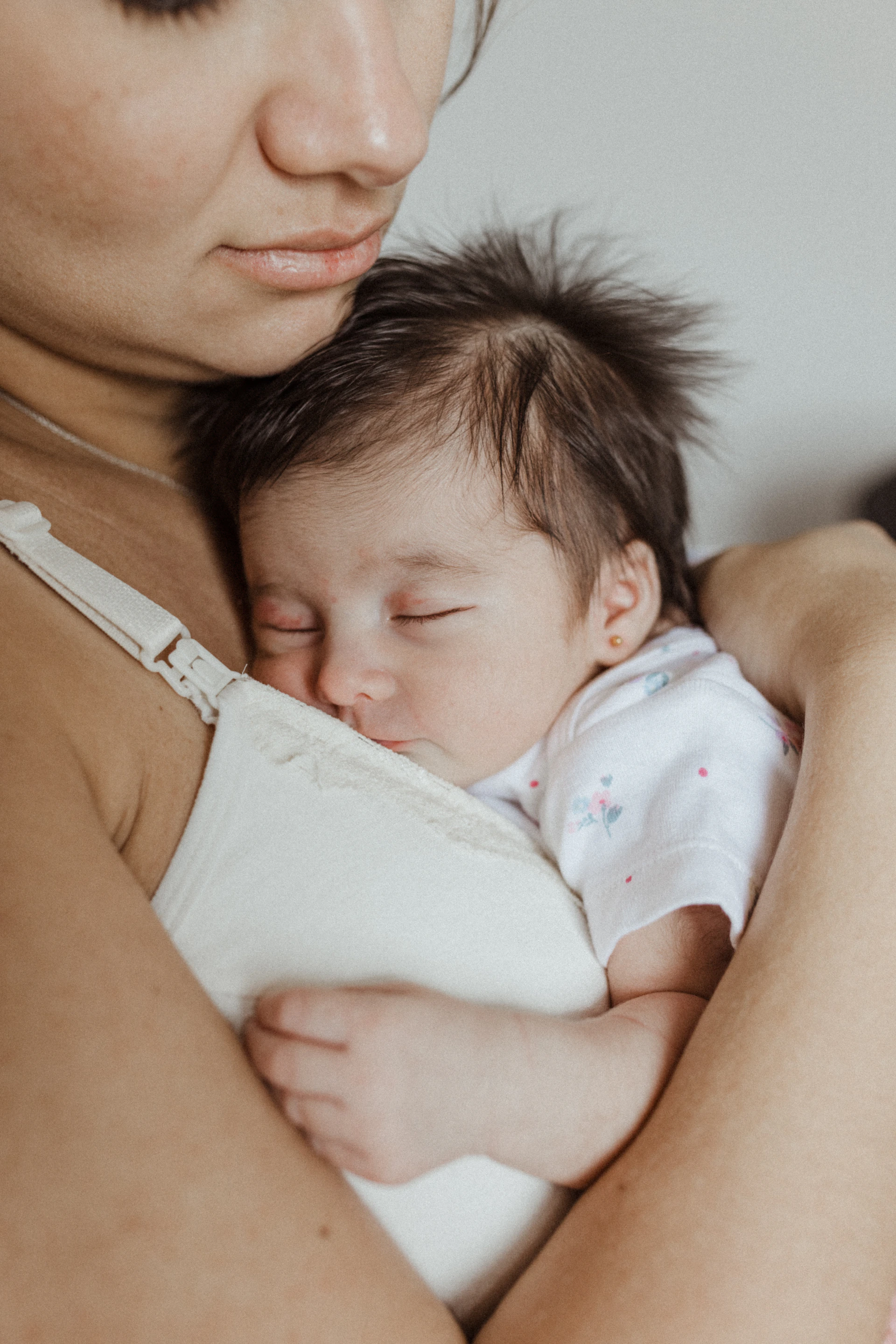 a woman holding a baby in her arms