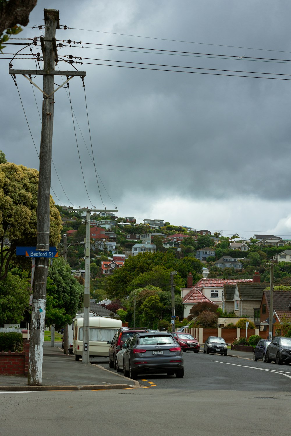 cars are parked on the side of the road