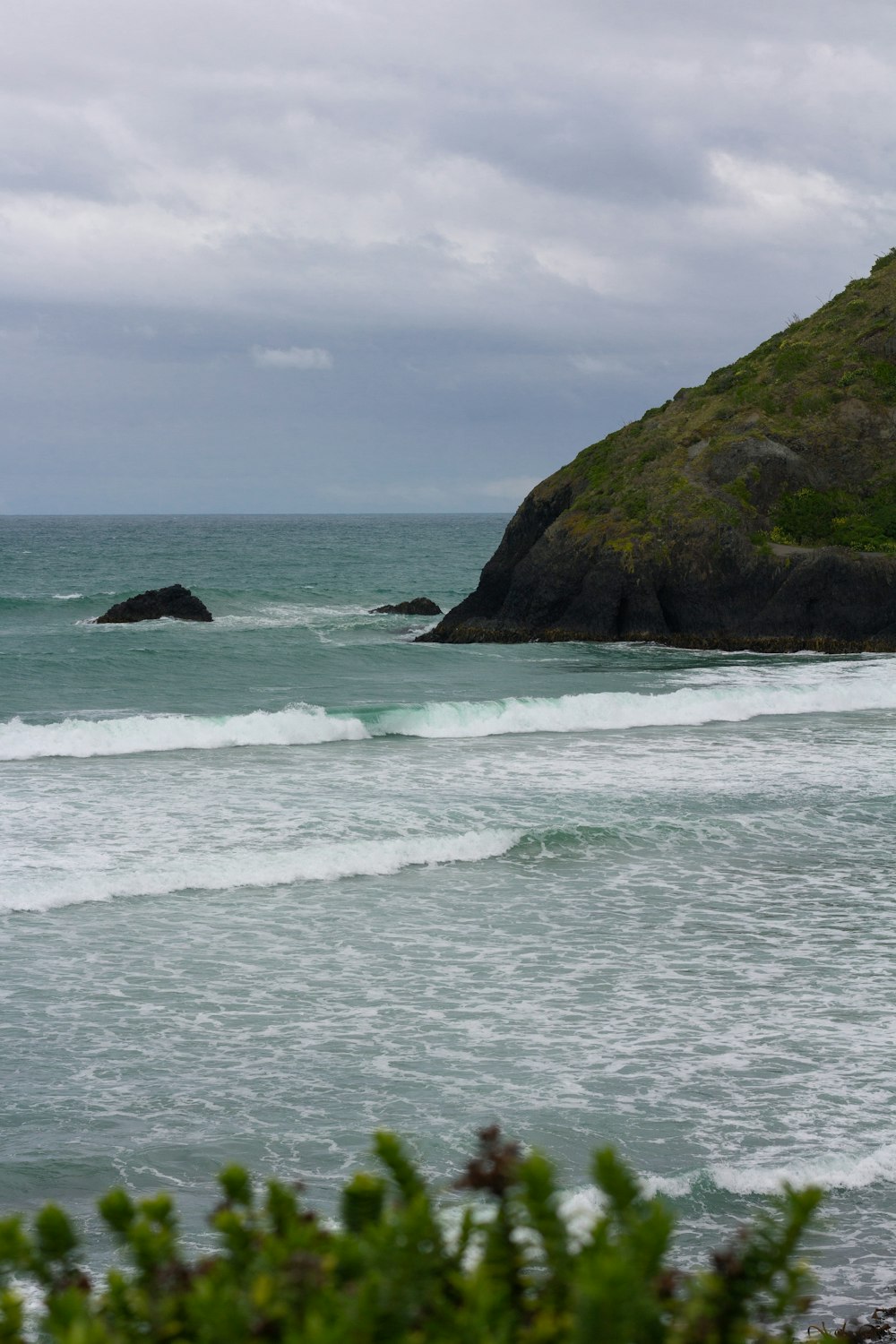 a person riding a surfboard on a wave in the ocean