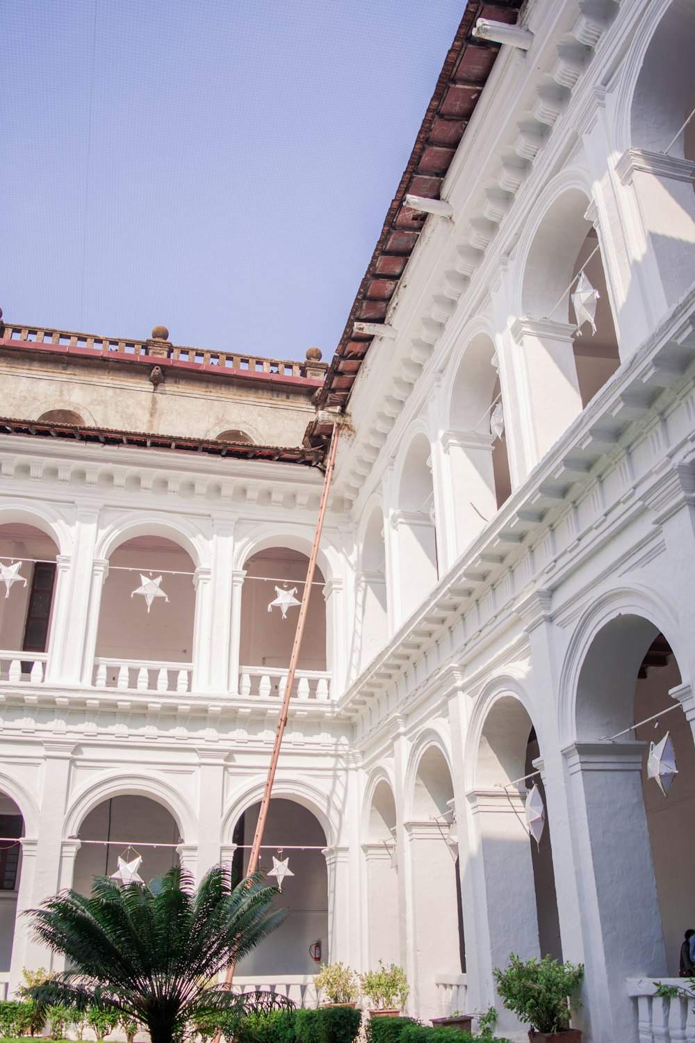 a large white building with arches and arches