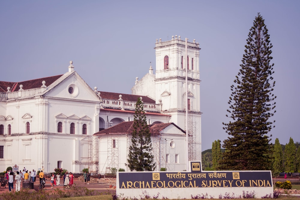 a group of people standing in front of a church