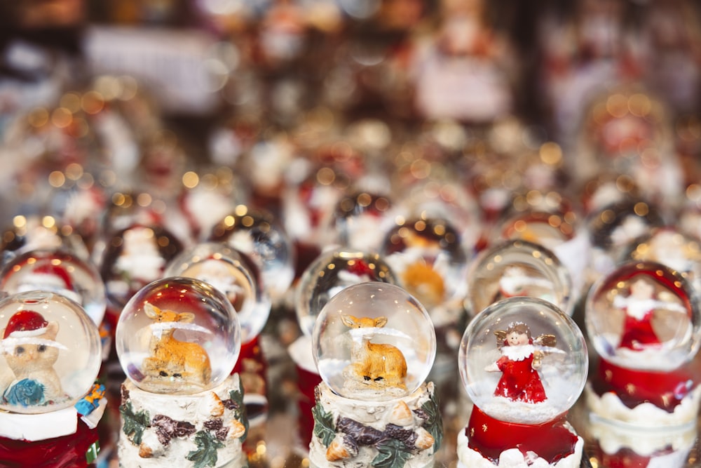 a group of snow globes with a santa clause in the middle