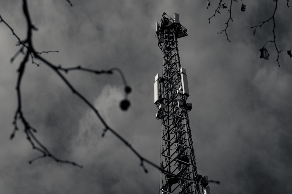 a very tall tower sitting under a cloudy sky