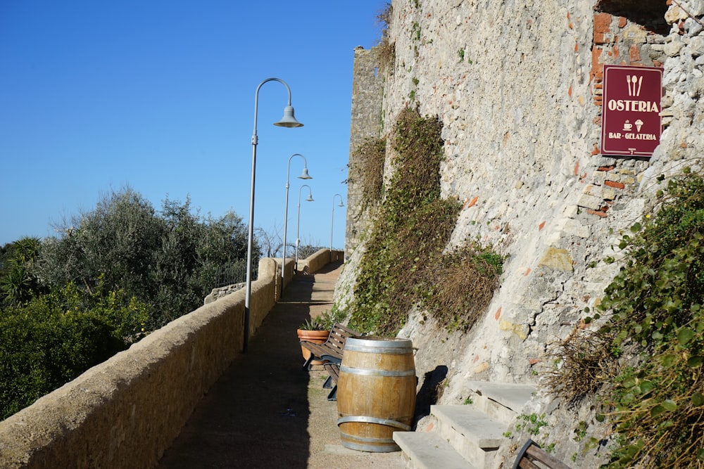 a stone wall with a sign on it