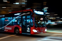 A bus in motion on a city road.