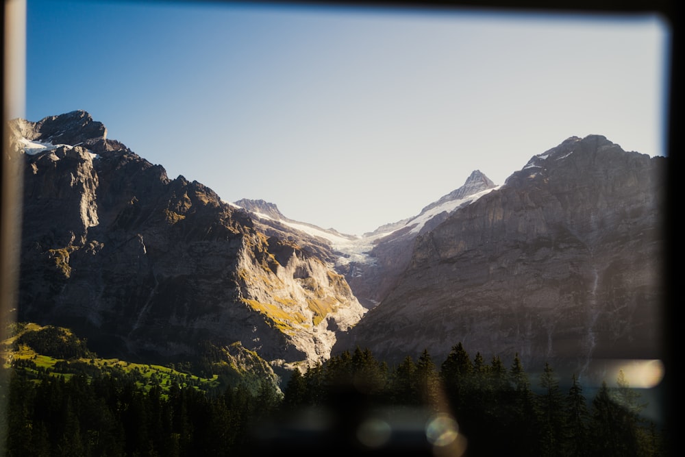 a view of a mountain range through a window