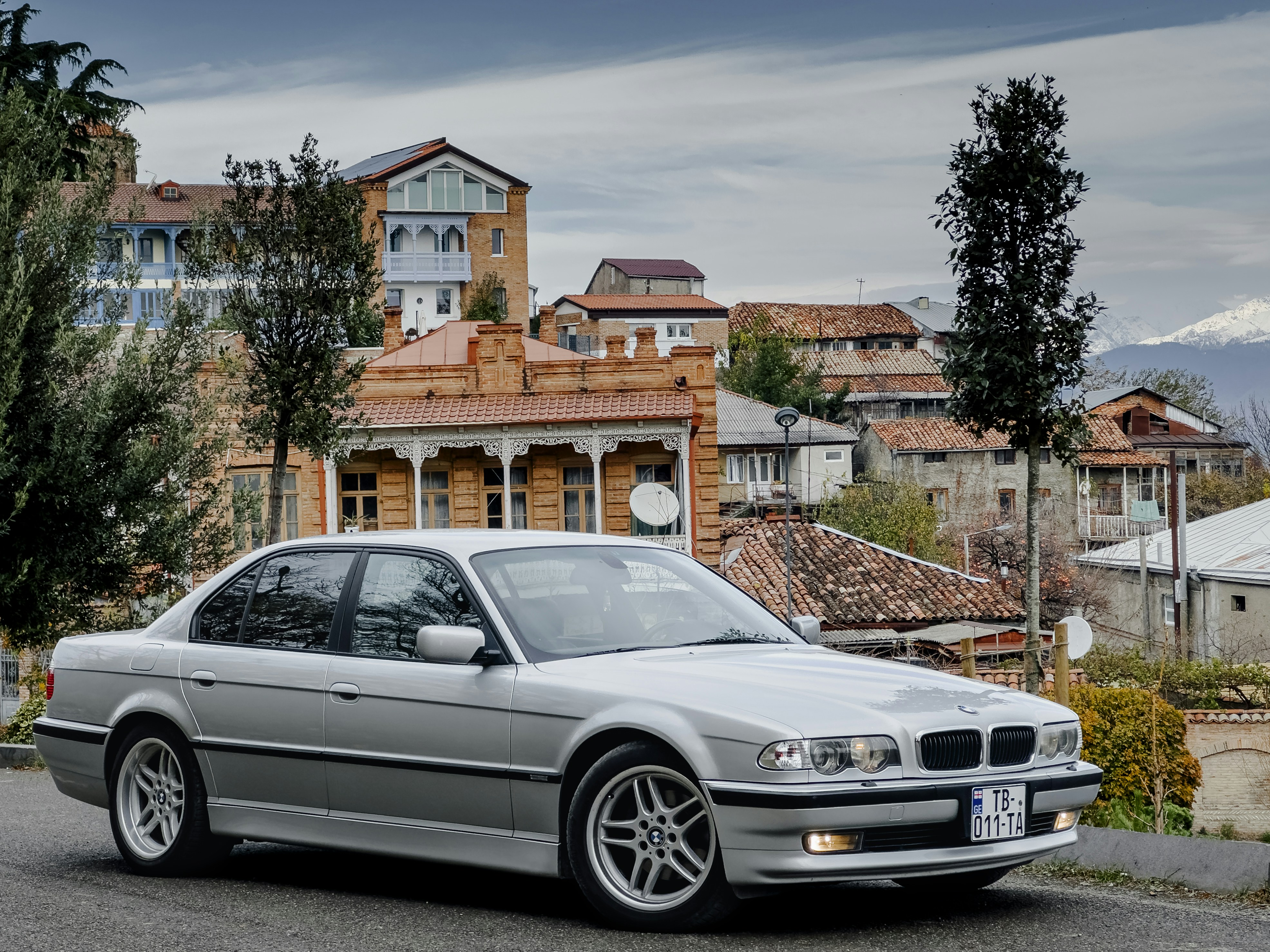a silver car parked on the side of the road