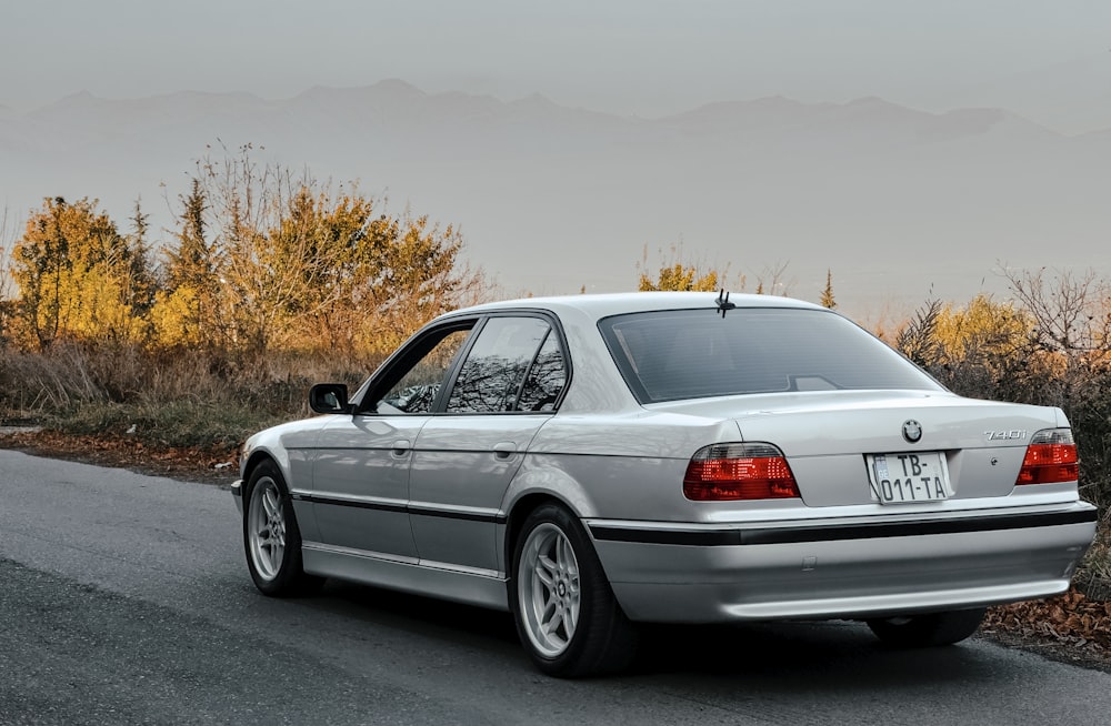 a silver car parked on the side of the road