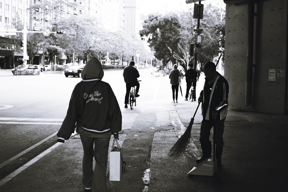 a group of people walking down a street