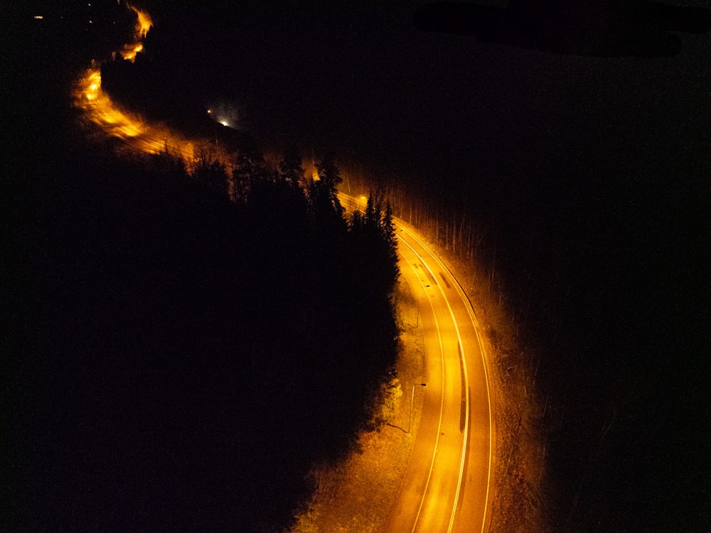 a long exposure shot of a road at night