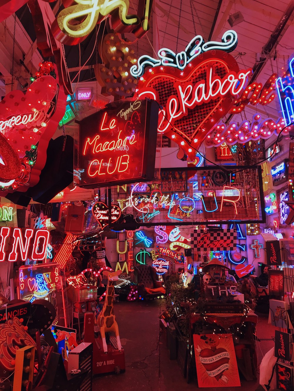 a room filled with lots of neon signs