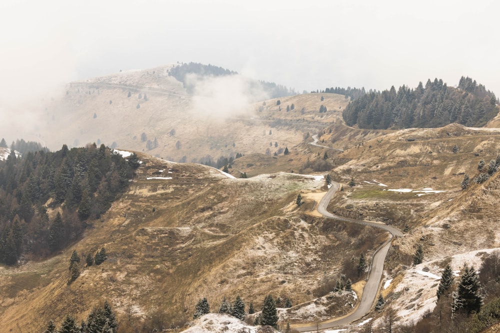 a winding road in the middle of a mountain