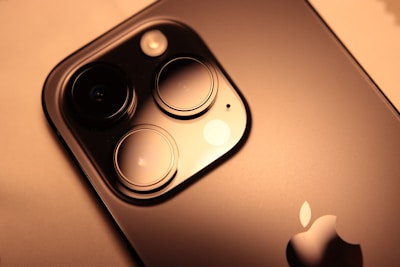 Realistic titanium-look camera upgrade case transforming an older iPhone model