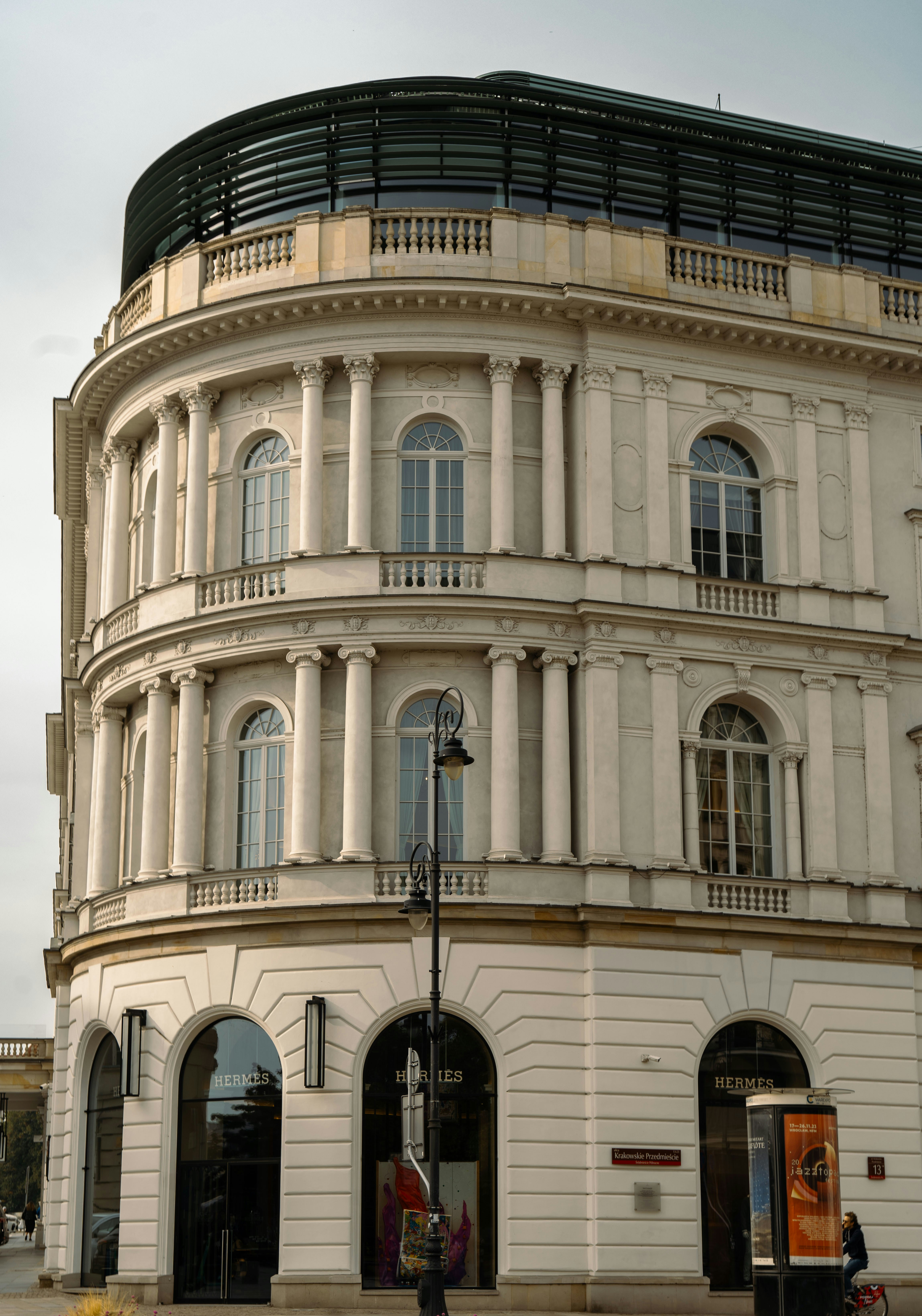 a large white building with a black roof
