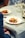 A satisfied customer enjoying a beautifully plated dish at a fine dining event.