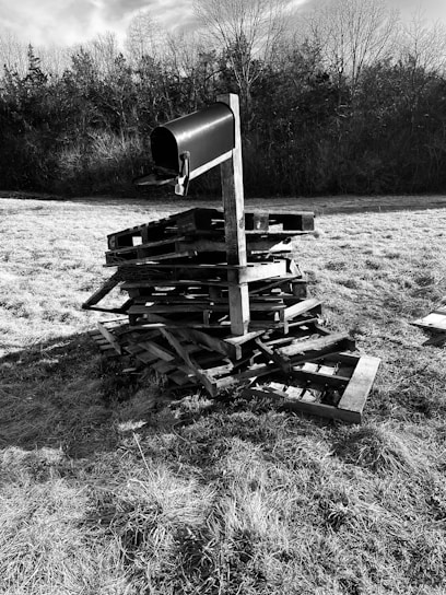 A sleek, modern mailbox with the Nevada desert in the background under a clear blue sky.