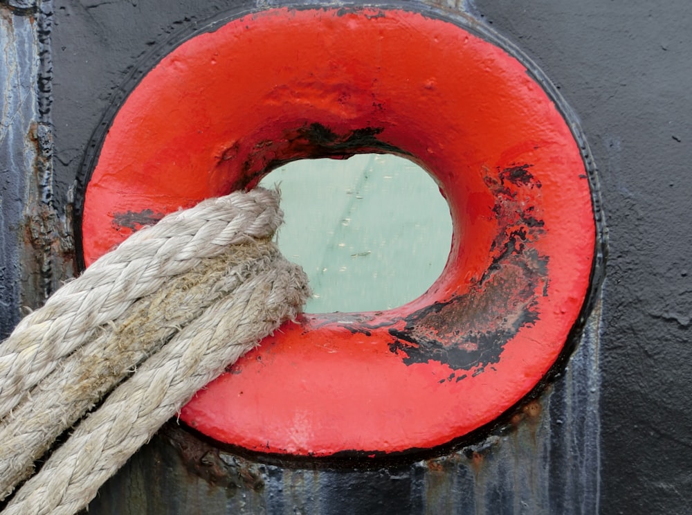 a rope is tied to a round red object
