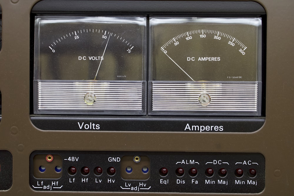 a close up of a radio with volts and ammeters