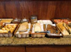 a counter topped with lots of different types of food