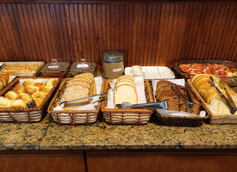 a counter topped with lots of different types of food