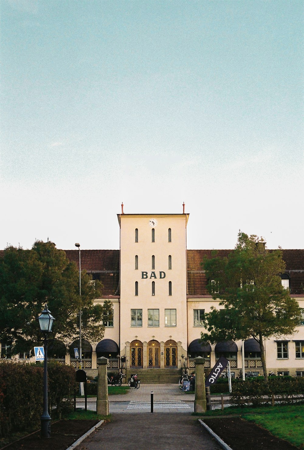 a large building with a lot of trees in front of it