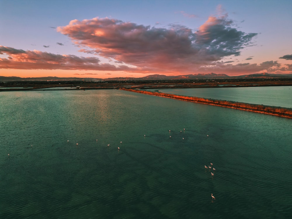 a large body of water with a sky background