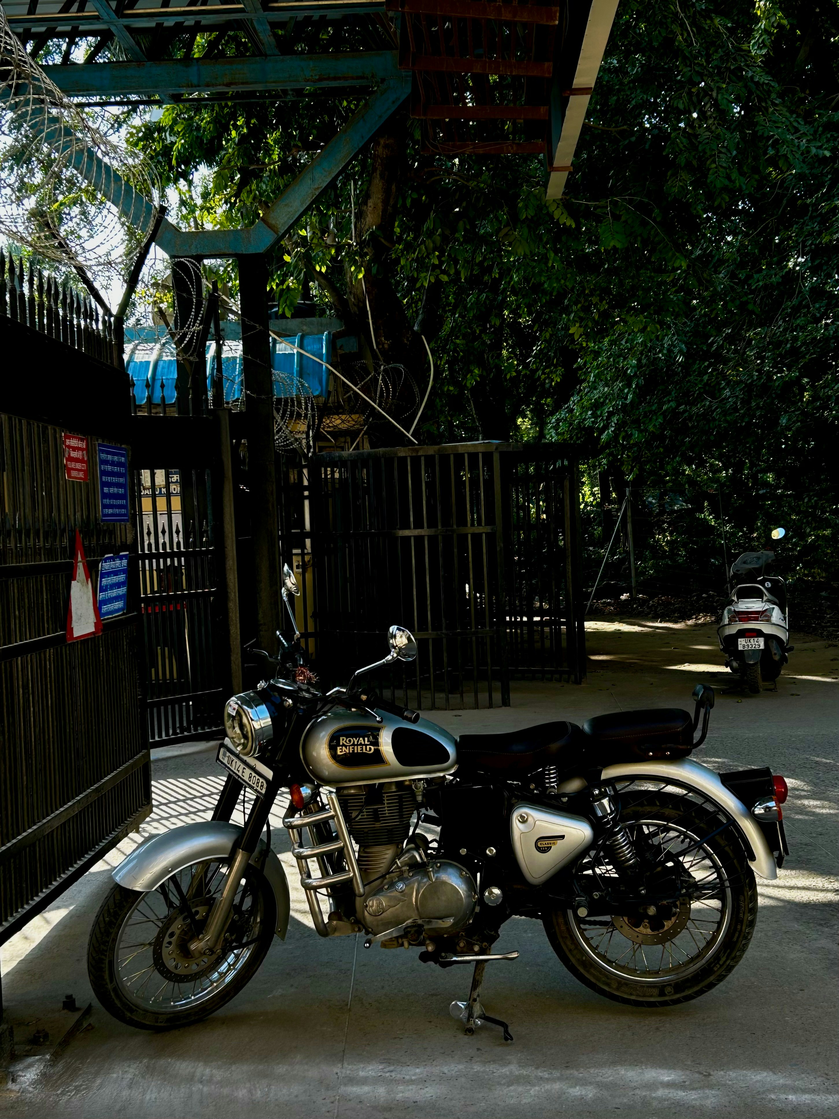 a motorcycle parked in front of a fence