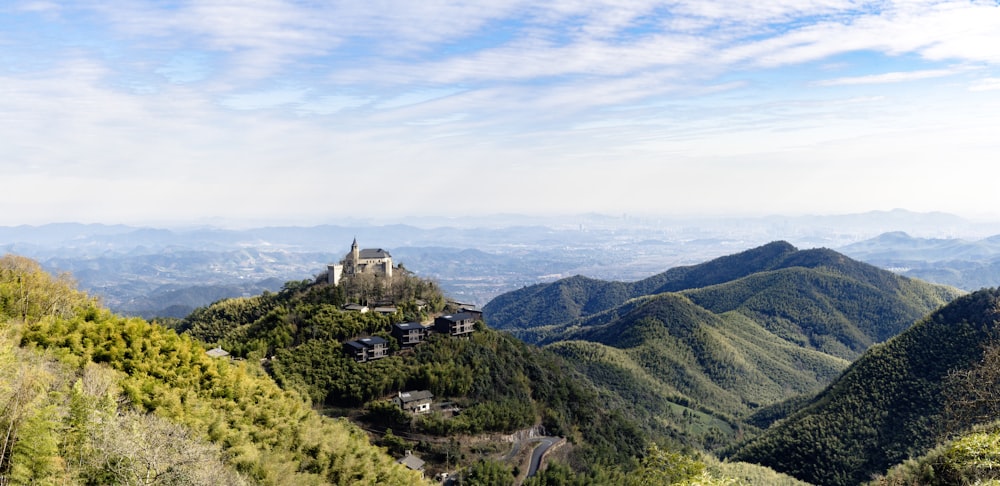 a scenic view of a mountain with a castle on top