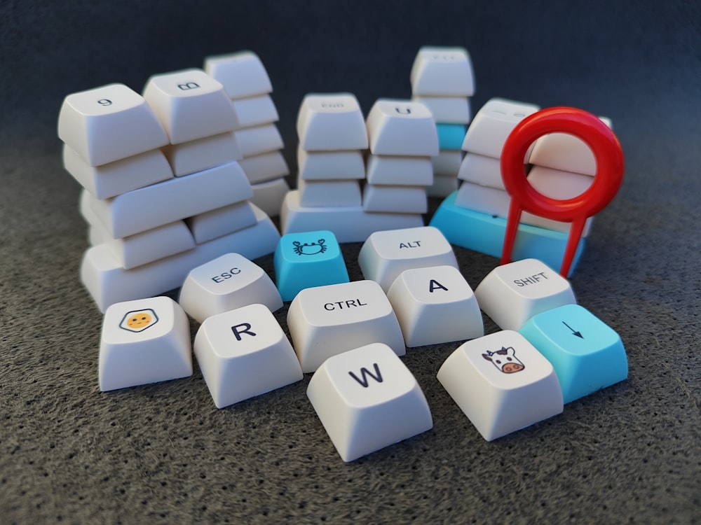 a computer keyboard with a bunch of keys on top of it