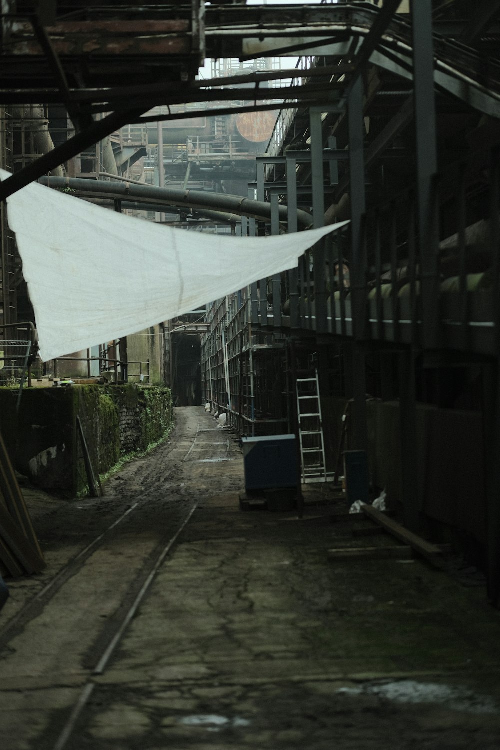 a train track with a white cloth hanging from it's side