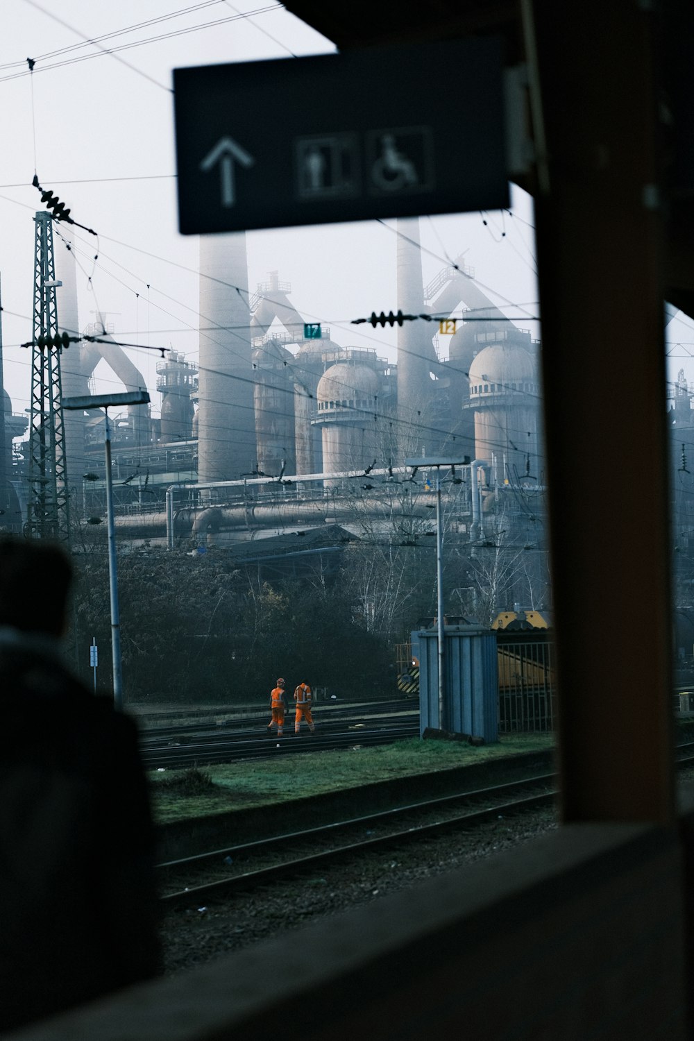 a train station with a train on the tracks