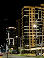 Streetlights illuminating a modern urban area during evening hours.