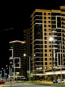 Streetlights illuminating a modern urban area during evening hours.