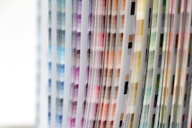 Various pages with vertical columns of color swatches arranged in a pattern, displaying a spectrum ranging from blues and purples to browns and greens.