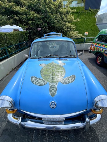 A playful scene showing a turtle exploring around a Ferrari F1 car replica with a beer bottle in the background.