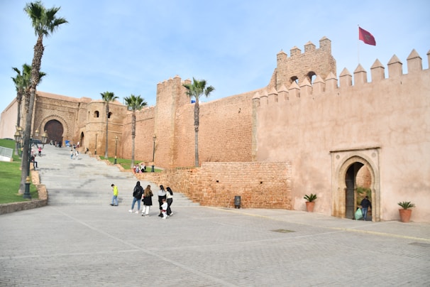 A guided tour group exploring a historic Fortaleza landmark on a sunny day