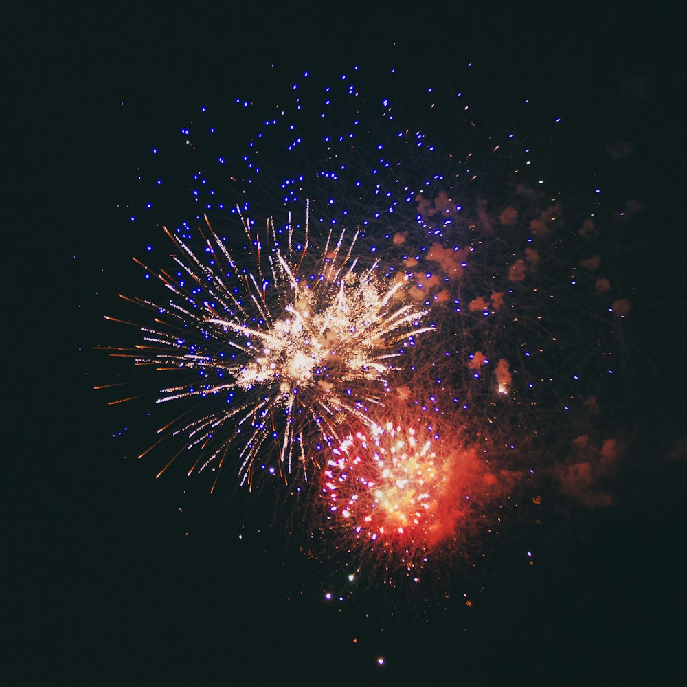 a colorful fireworks display in the night sky