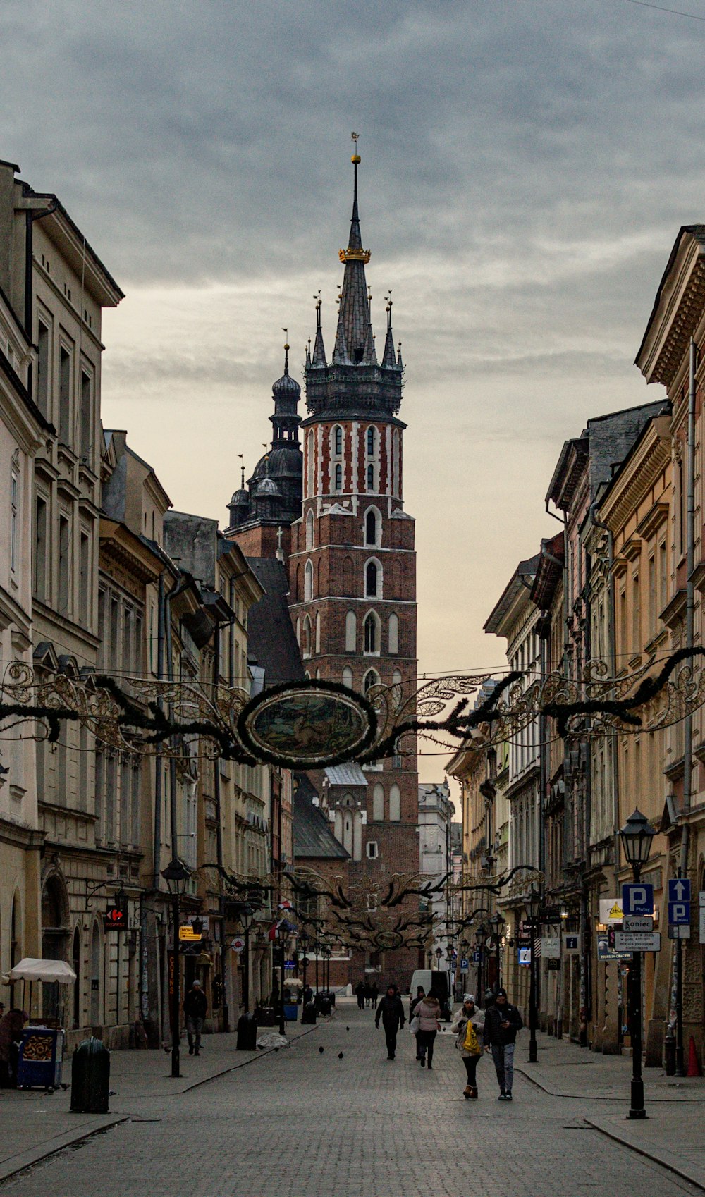 a city street with a clock tower in the background