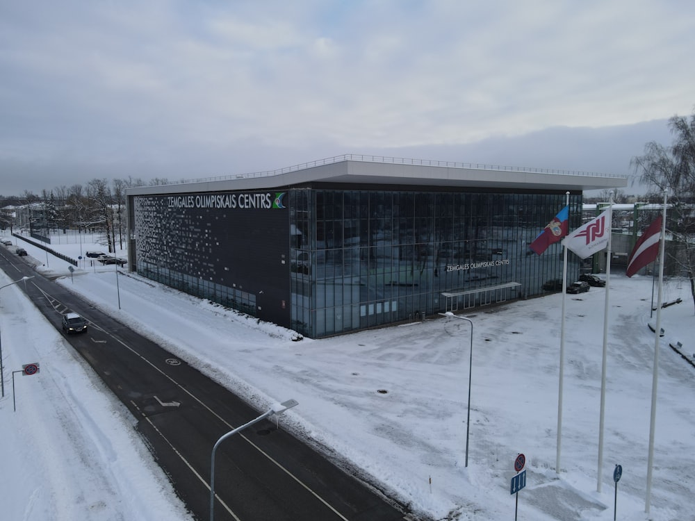 a building with a sign on the side of it in the snow