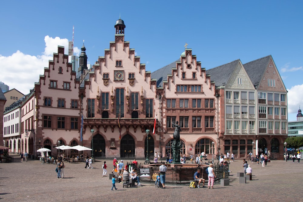 a large building with a fountain in front of it