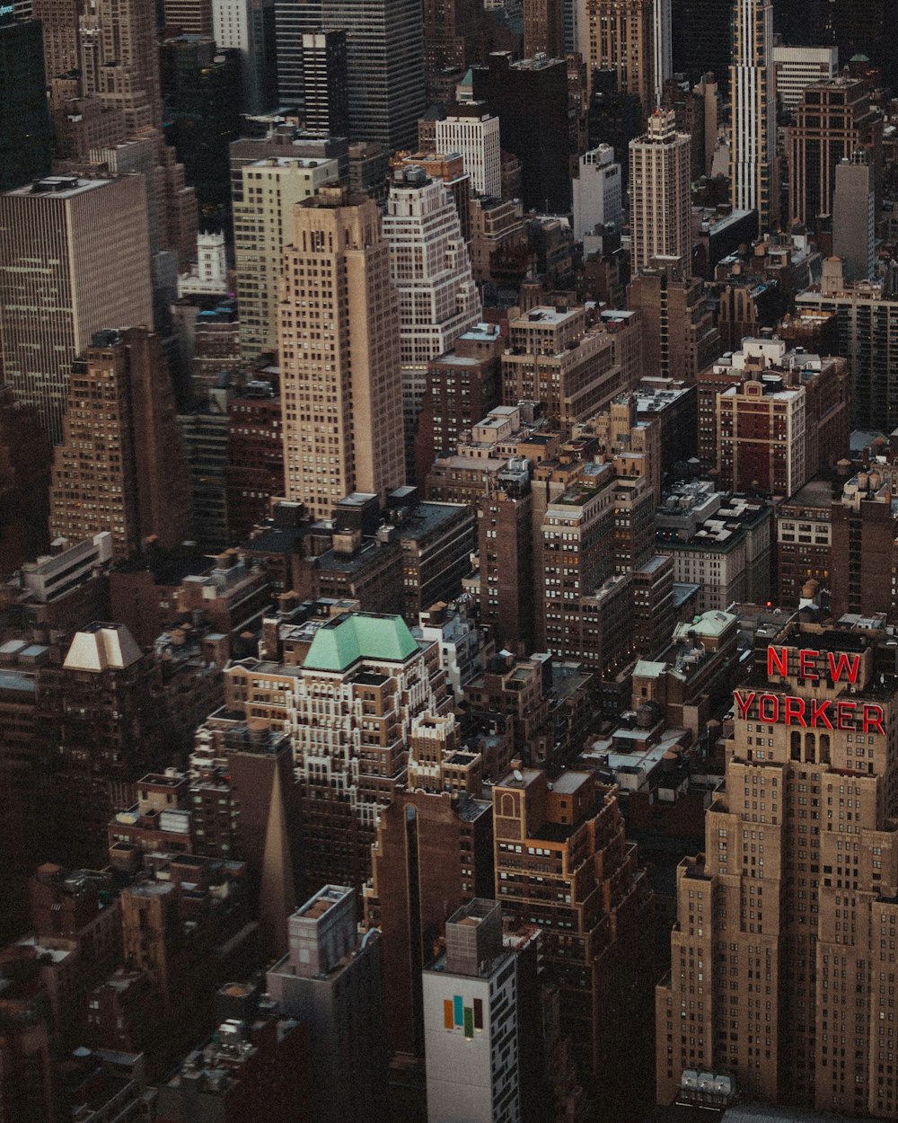 an aerial view of a city with tall buildings