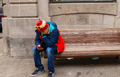 Sporty touchscreen gloves with vibrant accents on a city bench.