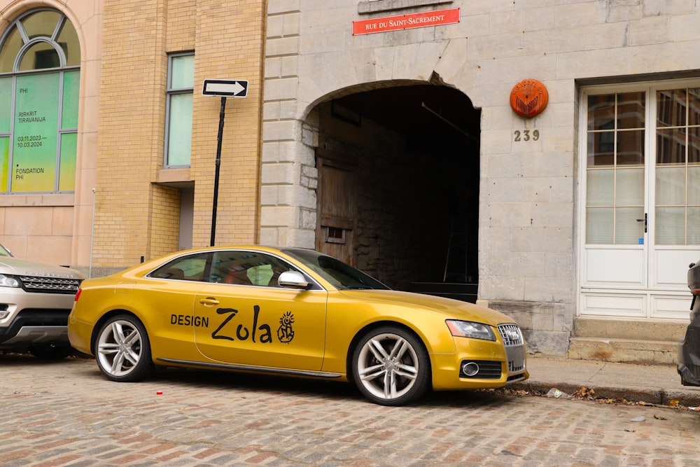 a yellow car parked in front of a building