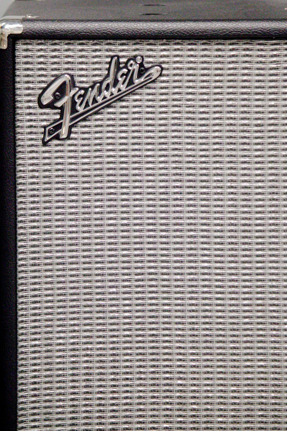 a fender guitar amplifier sitting on top of a table