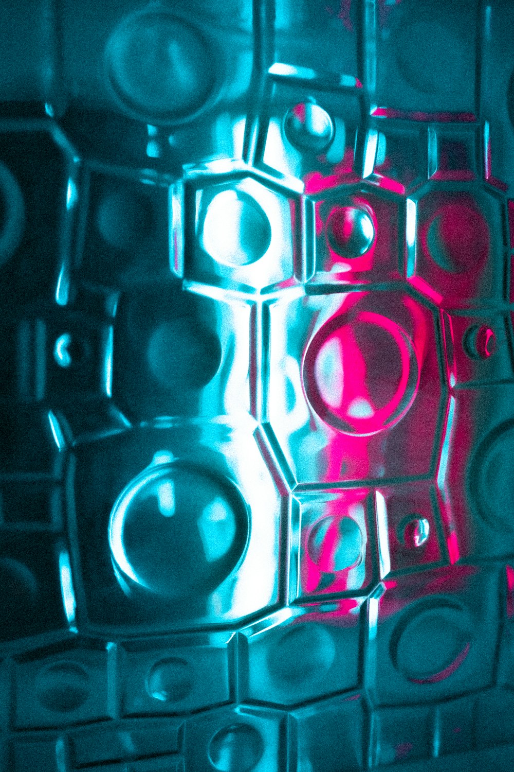 a close up of a glass block with a red light