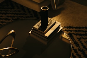 A casual living room setting featuring a favorite book and a recommended gadget on the side table