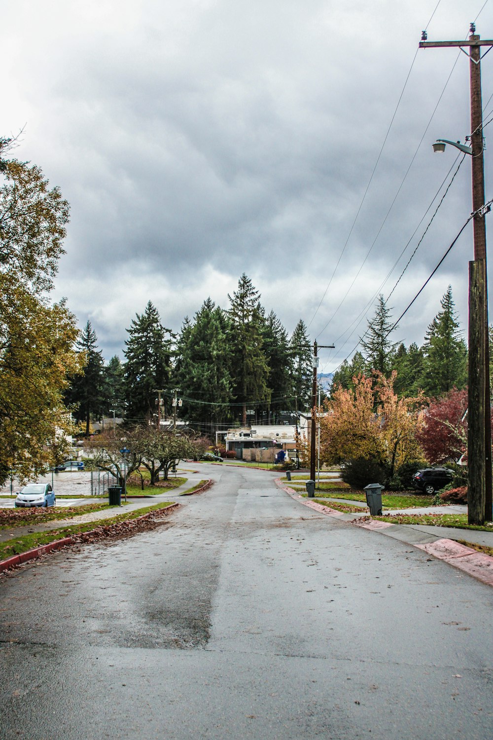 an empty street with a stop sign on the corner