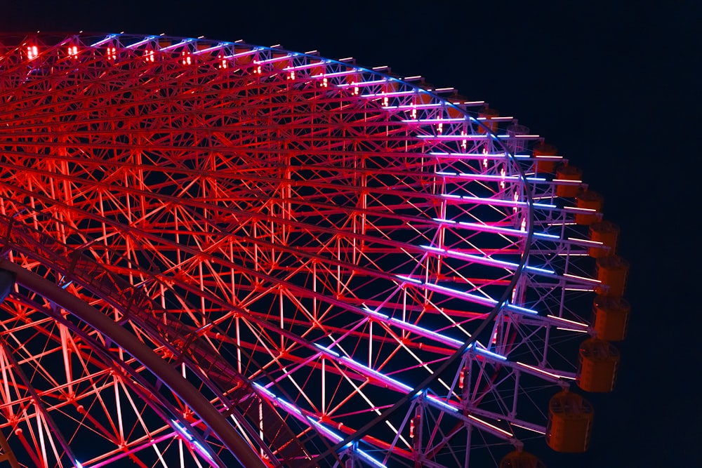 a large ferris wheel lit up at night