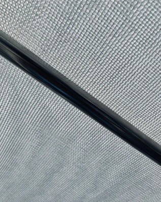Close-up showing the flexible and smooth surface of graphite nylon material